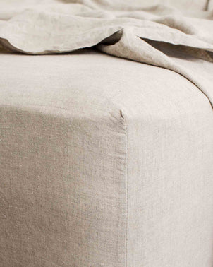 Natural-colored fitted bedding set from CULTIVER Bedroom Edit featuring artichoke, thatch, and natural tones.