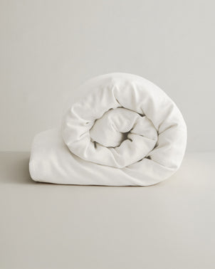 Ivory linen duvet cover by CULTIVER, showcasing soft, textured fabric with a smooth, elegant finish for a cozy bedroom look.