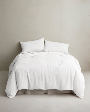 White linen duvet cover by CULTIVER styled on a bed, showcasing soft, breathable bed linen for a comfortable sleep.