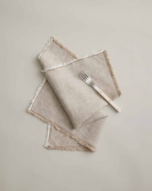 Natural-colored Fia napkins from CULTIVER, elegant table linen with soft fabric and simple design, perfect for dining settings.