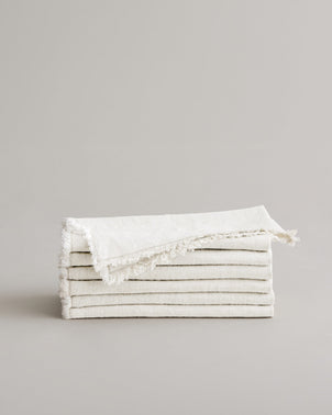 Stack of ivory Fia Napkins, elegant CULTIVER table linen with a soft, natural fabric finish for refined dining settings.