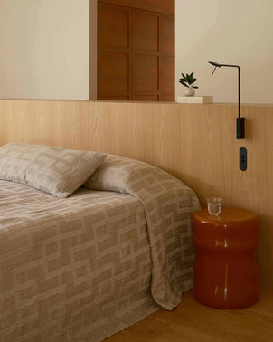 Natural-colored CULTIVER Rolfes bedcover draped over a bed, showcasing soft fabric and cozy design for a stylish bedroom look.