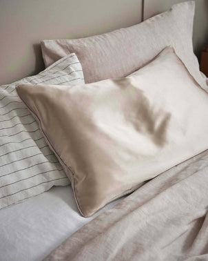 Natural silk linen flip pillowcase by CULTIVER, showcasing smooth, luxurious fabric and elegant natural color for bed linen.